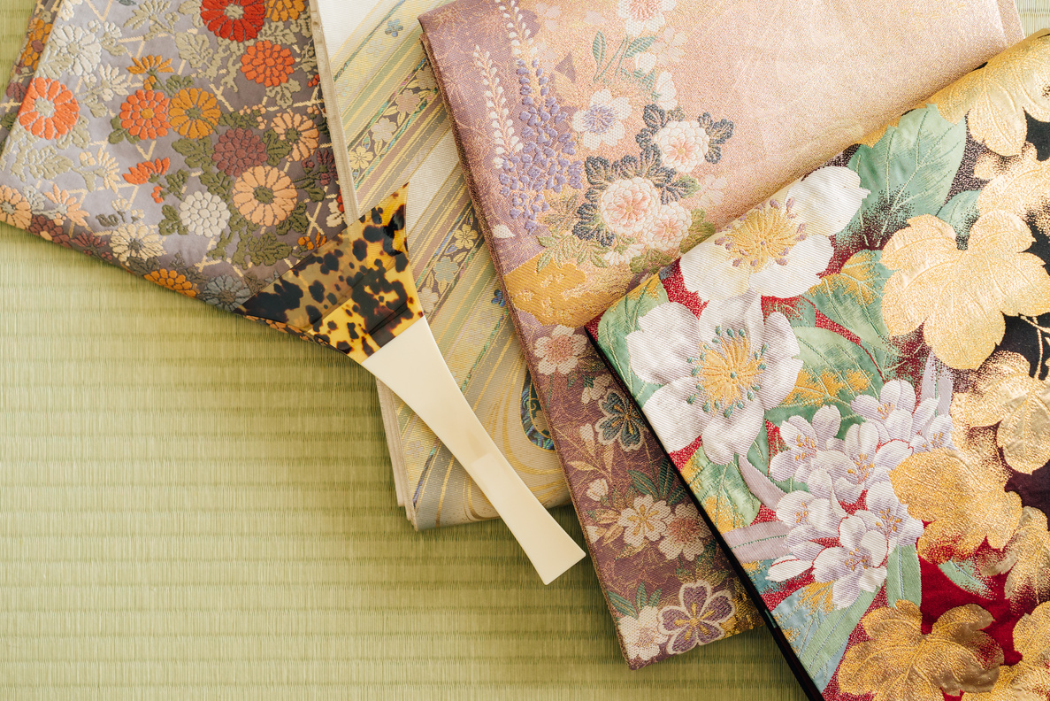 Shamisen Pick and Floral Fabrics on a Table